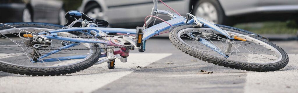 Bicycle in the road after being involved in an accident.