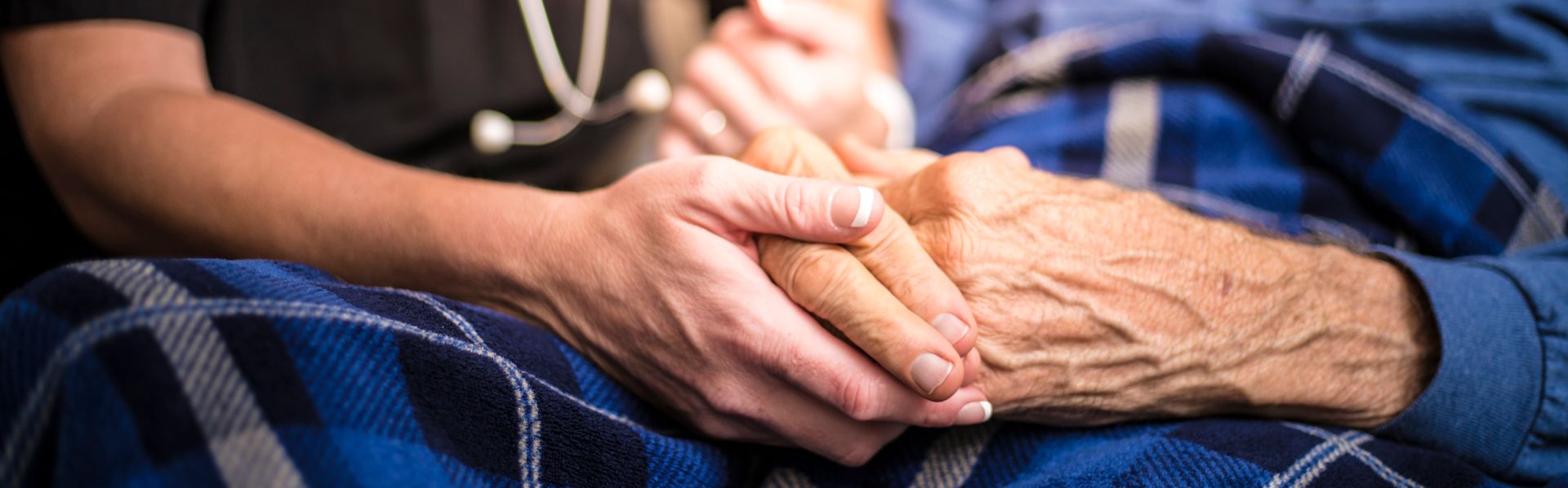 Nursing home worker caring for an elderly patient