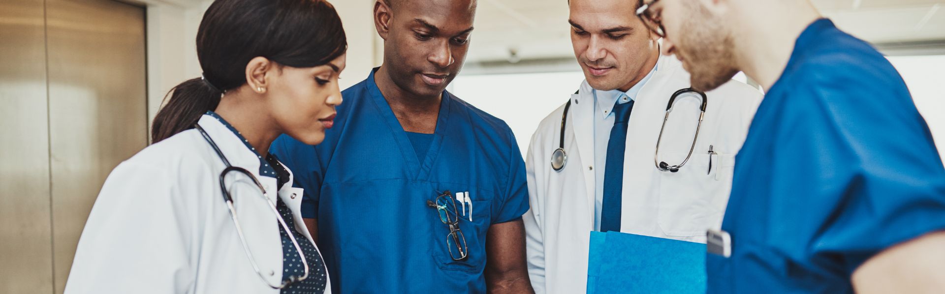 Medical doctors and hospital staff discussing medical malpractice case of a patient