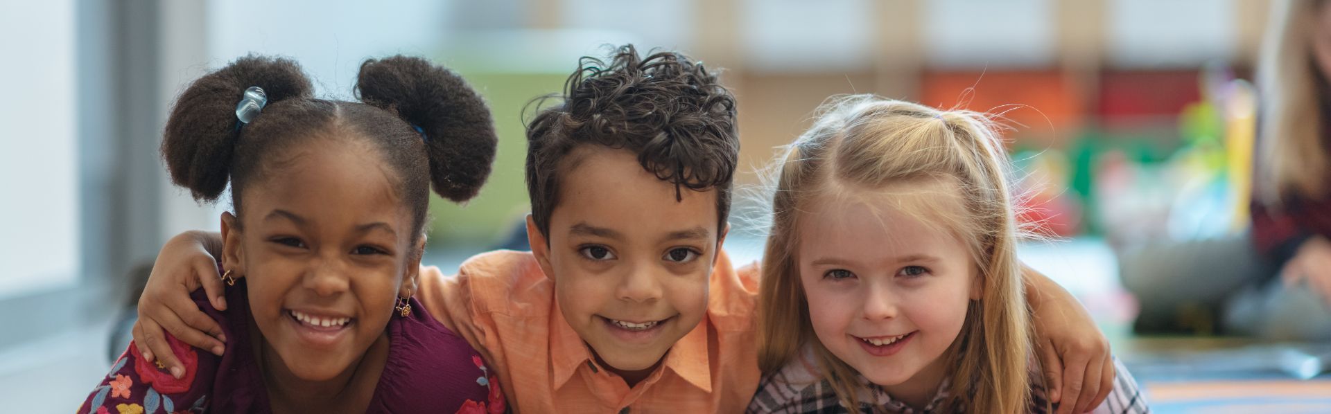 Young children playing together with the potential for injury.