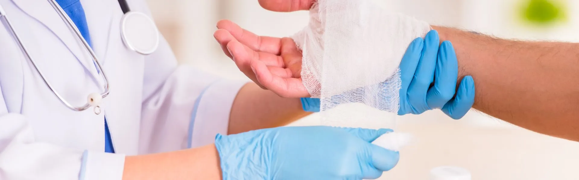 Nurse bandaging hand