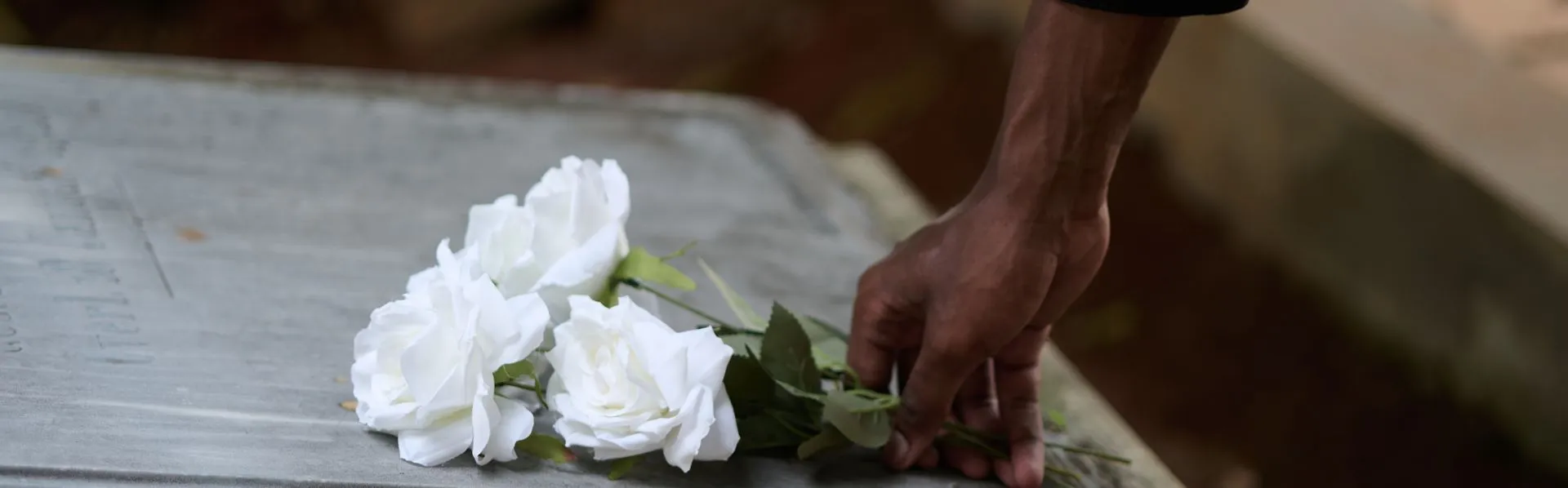 flowers on casket at funeral