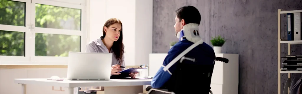 Injured man speaking with a Columbus personal injury lawyer